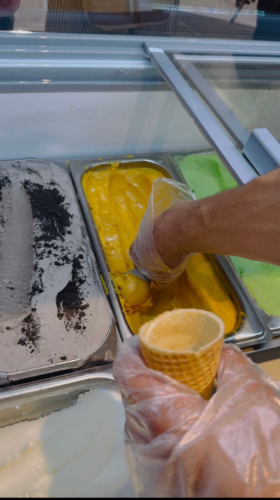 Mango gelato scoop